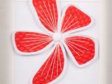 a picture of a picture of a flower made out of paper