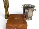 two vases and a box on a white surface
