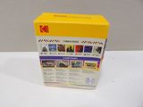the box is open to show the contents of a photo album