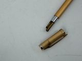 two pens sitting next to each other on a table