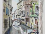 a watercolor painting of a boat in a canal