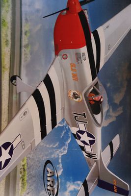 a toy airplane that is flying in the sky