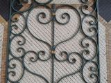 a decorative iron gate on the floor of a building