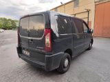 a black van that is parked in a parking lot