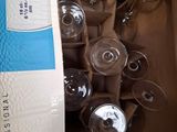 many empty wine glasses in a box on the table