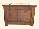 a wooden chest with a metal latch on it