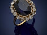 a sapphire and diamond ring, by person