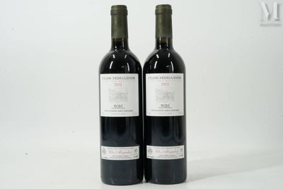 two bottles of wine sitting next to each other on a table