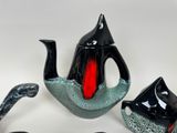 three pieces of art that include a teapot, a teapot, and a spoon
