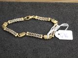 a close up of a bracelet with a tag on it