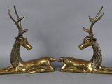 pair of brass deer figurines with antlers on legs