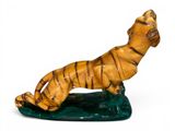 figurine of a tiger on a green base on a white background