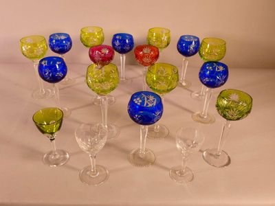a lot of wine glasses that are sitting on a table