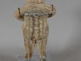 a statue of a teddy bear with a sign on it