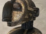 statue of a man with a helmet on his head in a museum