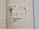 an open book with a picture of a man sitting on a bench