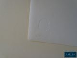 a piece of paper on the wall with a hole in it