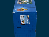 a blue box with stickers on it sitting on top of a table