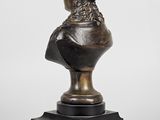 a bronze bust of a woman with a crown on her head
