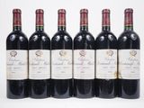 six bottles of red wine lined up in a row on a white surface