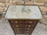 a small dresser with a mirror on top of it