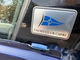 a picture of a yacht club capri sticker on the back of a car