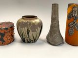 three different vases sitting next to each other on a table