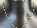 a gold necklace with an ankht and an ankht on it