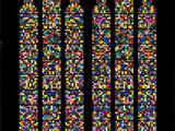 a stained glass window in a church with a black background