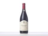 the bottle of wine is sitting on the table with a white background