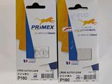 two boxes of primex adhesives on a white surface
