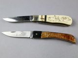 two knives that are sitting next to each other on a table