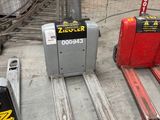many different types of forklifts in a warehouse