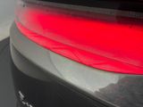 a close up of a car ' s tail light with a red tail light