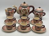 a group of coffee cups and saucers on a table
