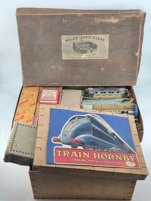 a box full of train items on a table