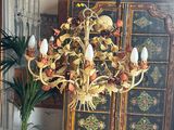 a plant that is sitting on a table in front of a cabinet