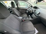 the interior of a small car with black seats and a steering wheel