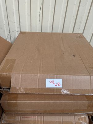 many boxes stacked on top of each other in a storage room