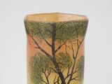 a vase that has a picture of a tree on it