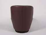 the back of a brown leather chair with a black base