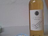 a bottle of wine and a box of soap on a table