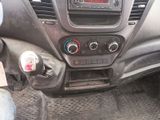 a dashboard of a car with a digital clock on it