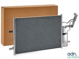 an aluminum radiator with a cardboard box and a pair of scissors