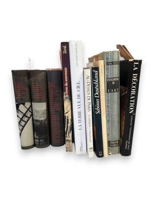many books that are on a shelf on the wall