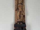 an image of a wooden sculpture of a man holding a child