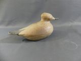 a small bird that is sitting on a table