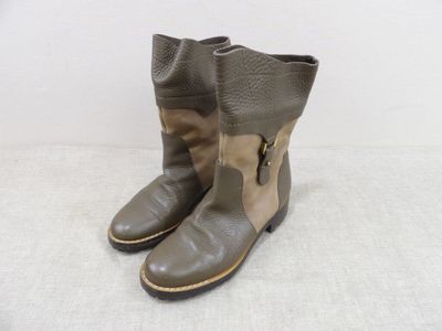 leather boots with zippers and buckles on the side of them
