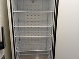 a white refrigerator with a door open in a kitchen
