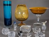 a lot of glass items that are sitting on a table